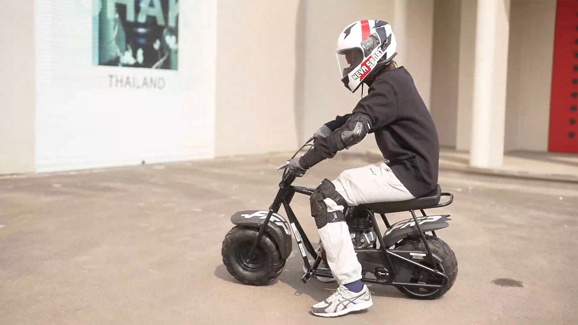 A boy is riding GMB100 gas mini bike