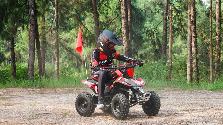 <img  src=What Is the Right Speed for a Kid’s Mini Quad and How to Set It Safely.jpg alt=a boy is riding a Sahara 40 gas mini quad >