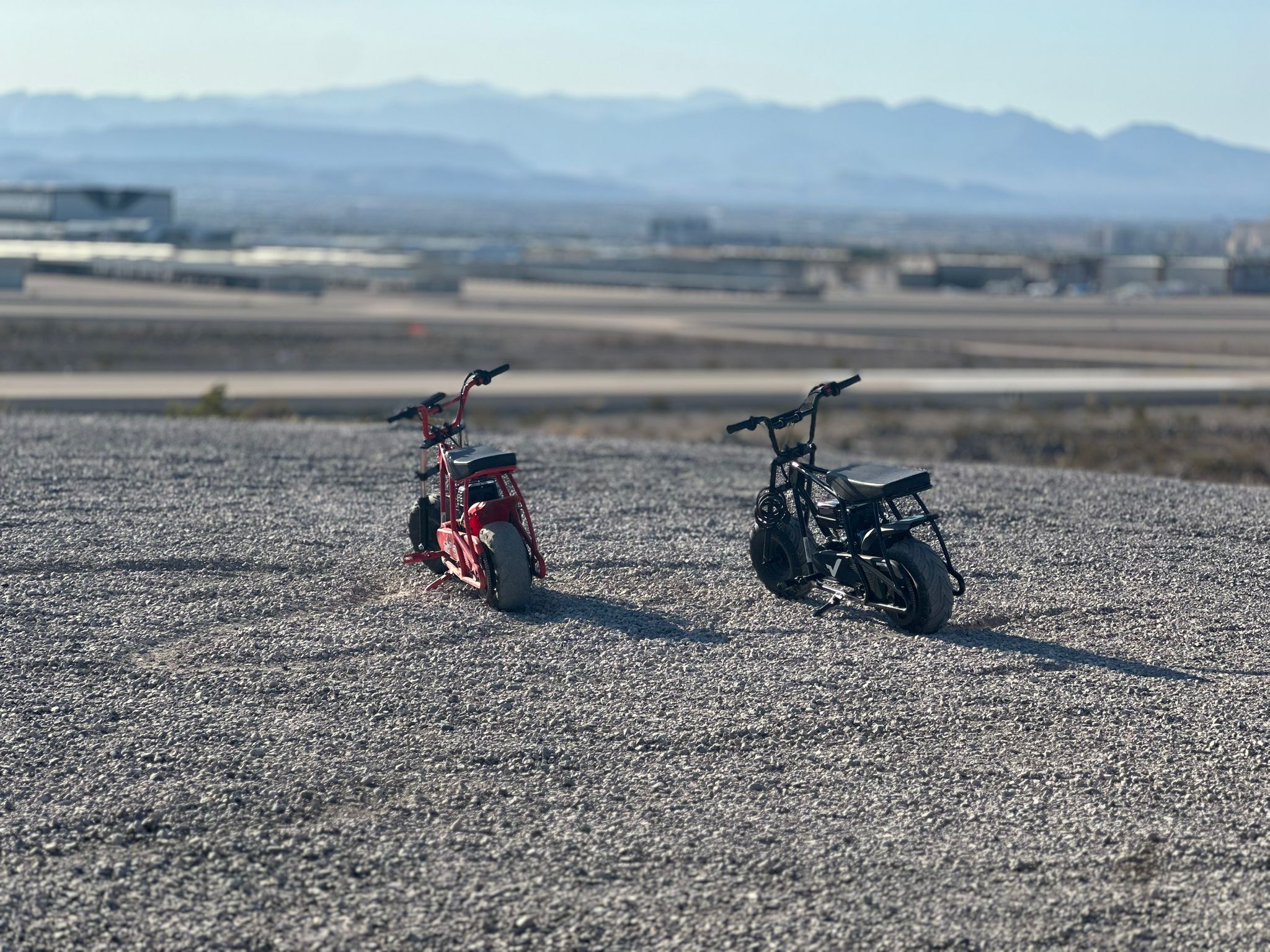 2 GMB100 gas mini bike is on the sandy place