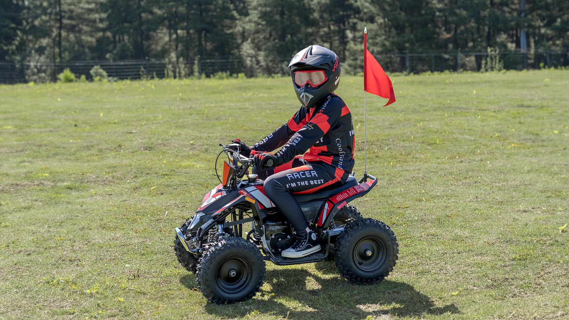 A kid who is riding a Sahara 40 mini atv