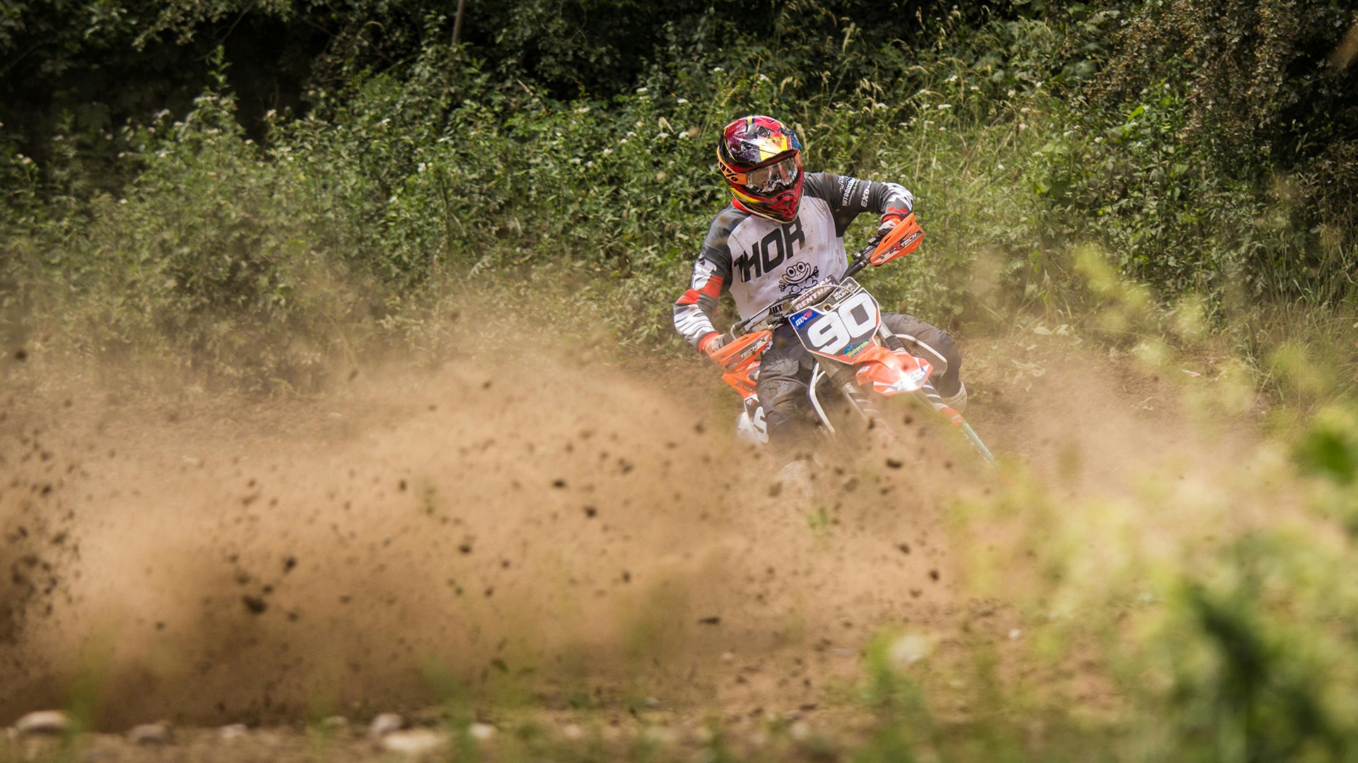 A man is riding a gas dirt bike.