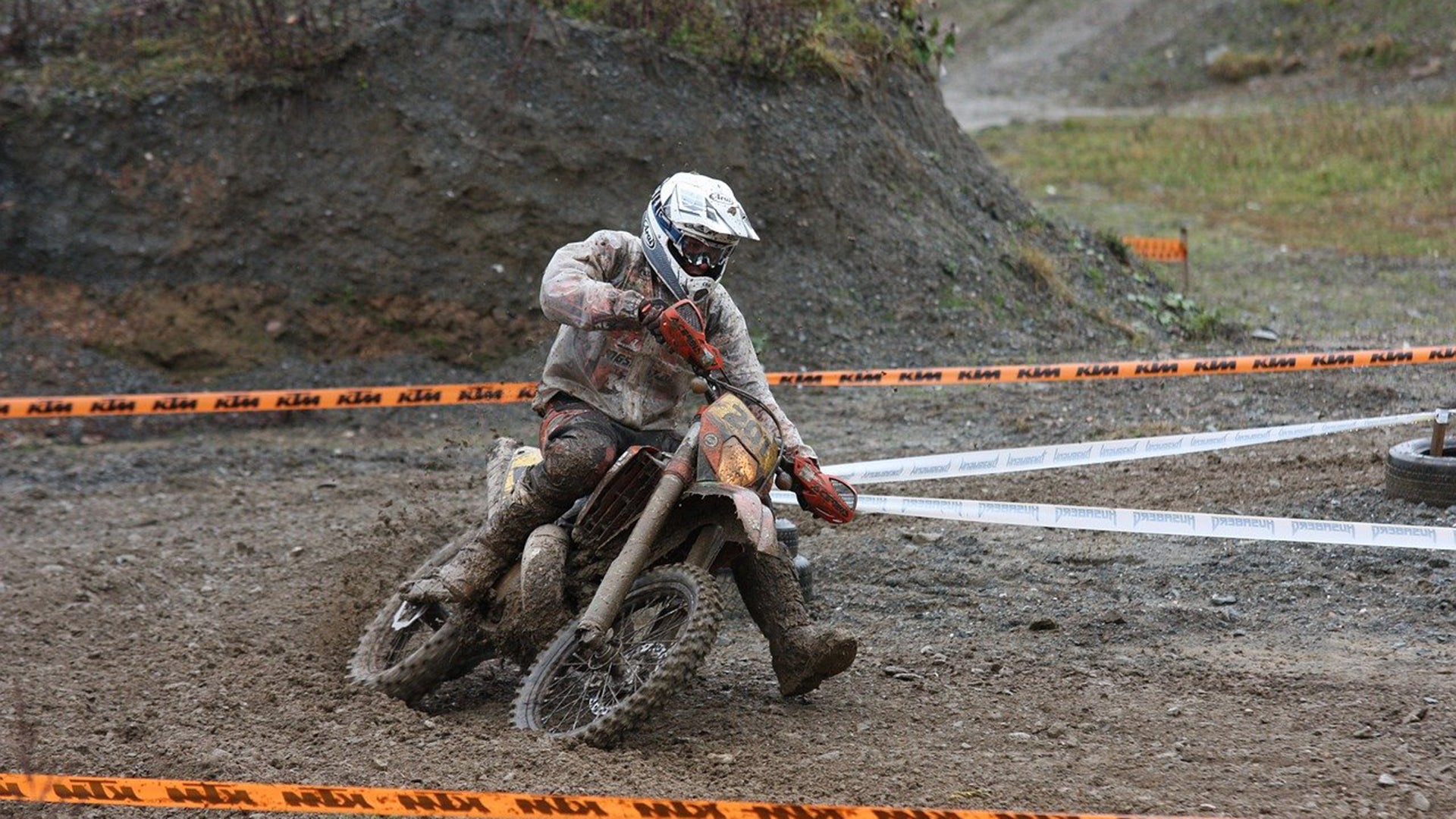 A man is riding a dirt bike.