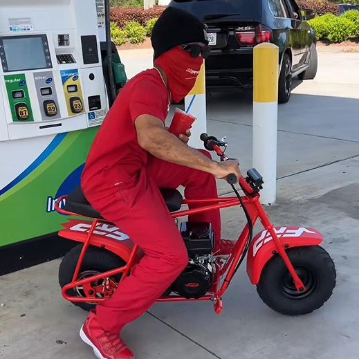 Darrius Anderson, who is all in red, is riding a red FRP GMB100 gas mini bike.